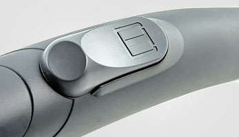 Flap on the hose for suction power adjustment Grey hose handle with a flap for mechanical suction power adjustment